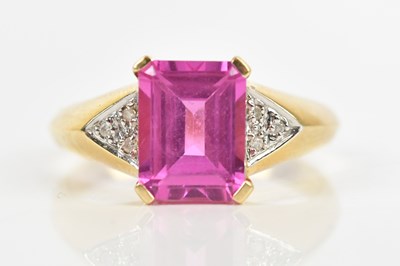 Lot 450 - A yellow metal dress ring, with a central...