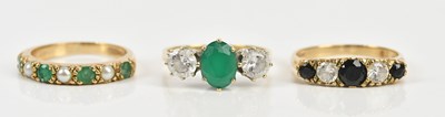 Lot 424 - Three 9ct yellow gold dress rings including a...