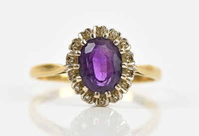 Lot 414 - An 18ct yellow gold amethyst set dress ring,...