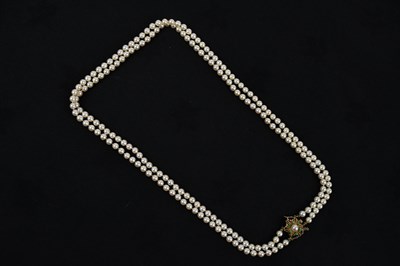Lot 283 - A double strand of cultured pearls, with...