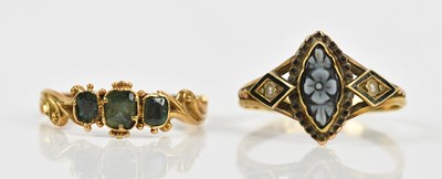 Lot 448 - An 18ct yellow gold dress ring, with carved...