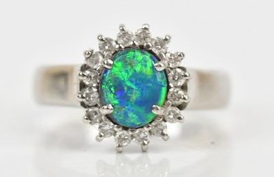 Lot 347 - A platinum diamond and opal set cluster ring,...
