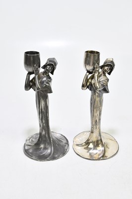 Lot 508 - A pair of Art Nouveau pewter candle holders...