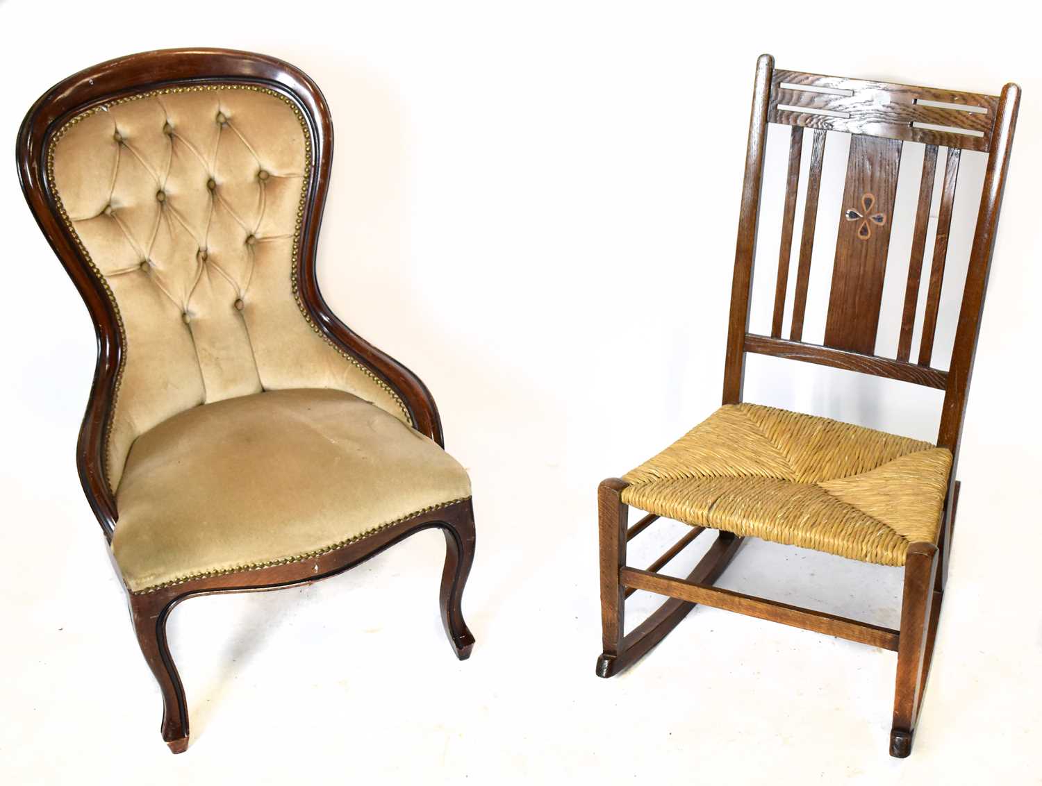 Lot 1649 - An Arts and Crafts inlaid oak rush seated rocking chair