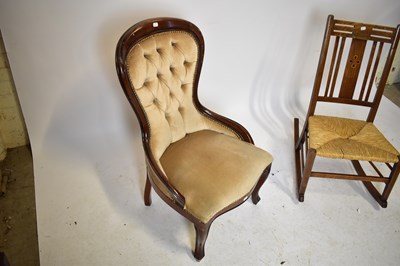 Lot 1649 - An Arts and Crafts inlaid oak rush seated rocking chair