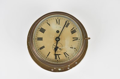 Lot 1328 - A brass cased ship's clock, the dial set with...