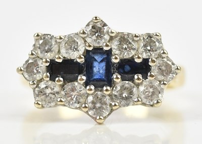 Lot 412 - A 9ct yellow gold diamond and sapphire set...