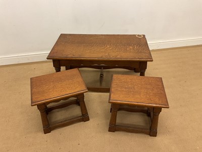 Lot 804 - A nest of three oak occasional tables, width...