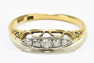 Lot 1126 - An 18ct yellow gold five stone graduated...