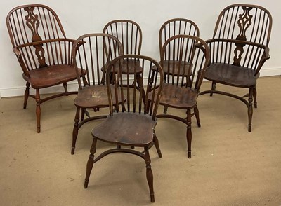 Lot 698 - A matched set of seven hoop back chairs with...