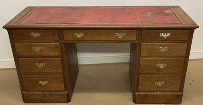 Lot 693 - ALBERT OAKROYD; a nine drawer oak twin...