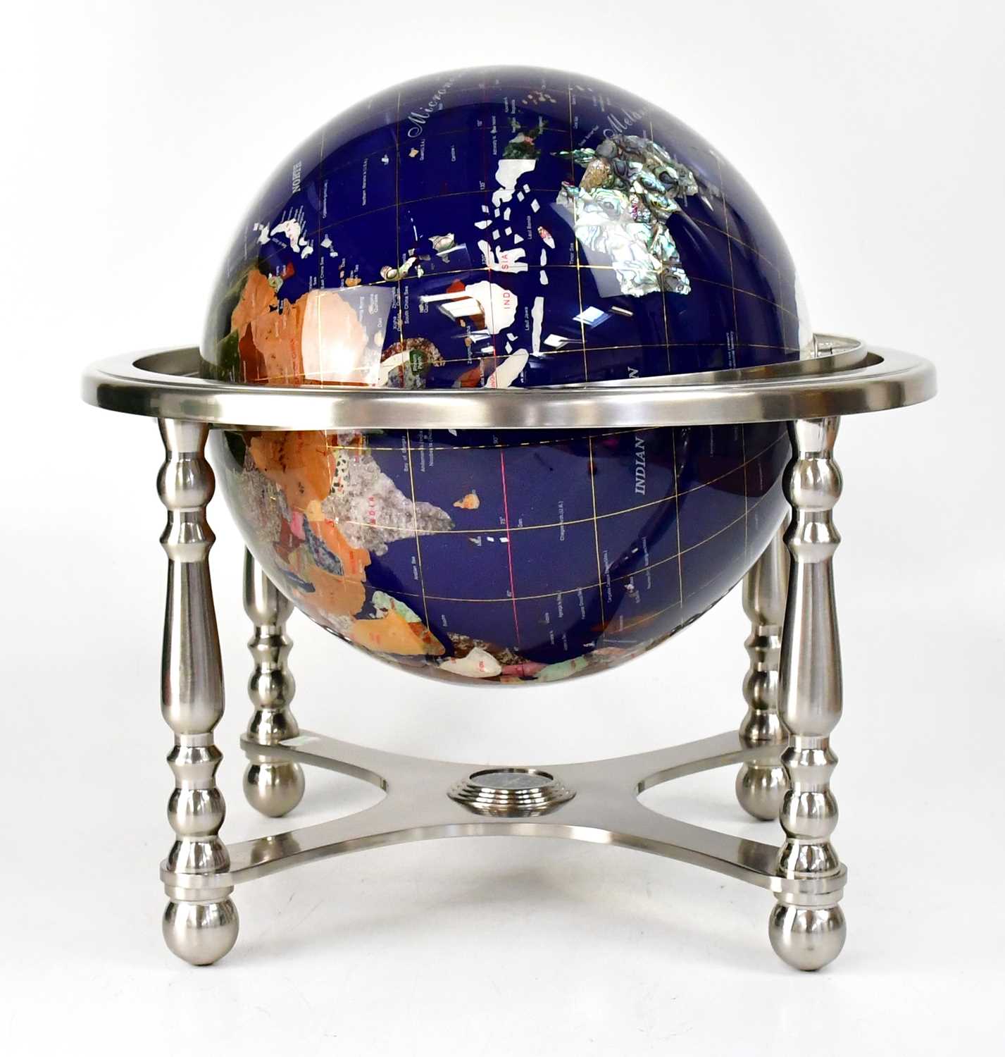 Lot 633 - A globe set with various semiprecious stones,...