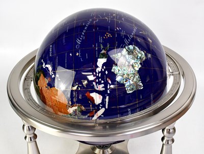 Lot 633 - A globe set with various semiprecious stones,...