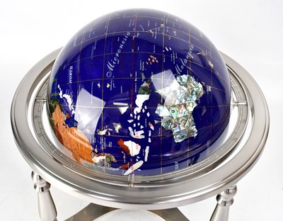 Lot 633 - A globe set with various semiprecious stones,...