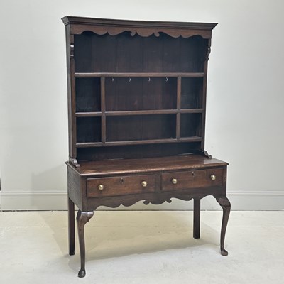 Lot 1058 - A late 18th century oak dresser, with boarded...