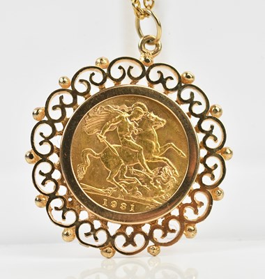 Lot 215 - A George V full sovereign, 1931, in 9ct gold...