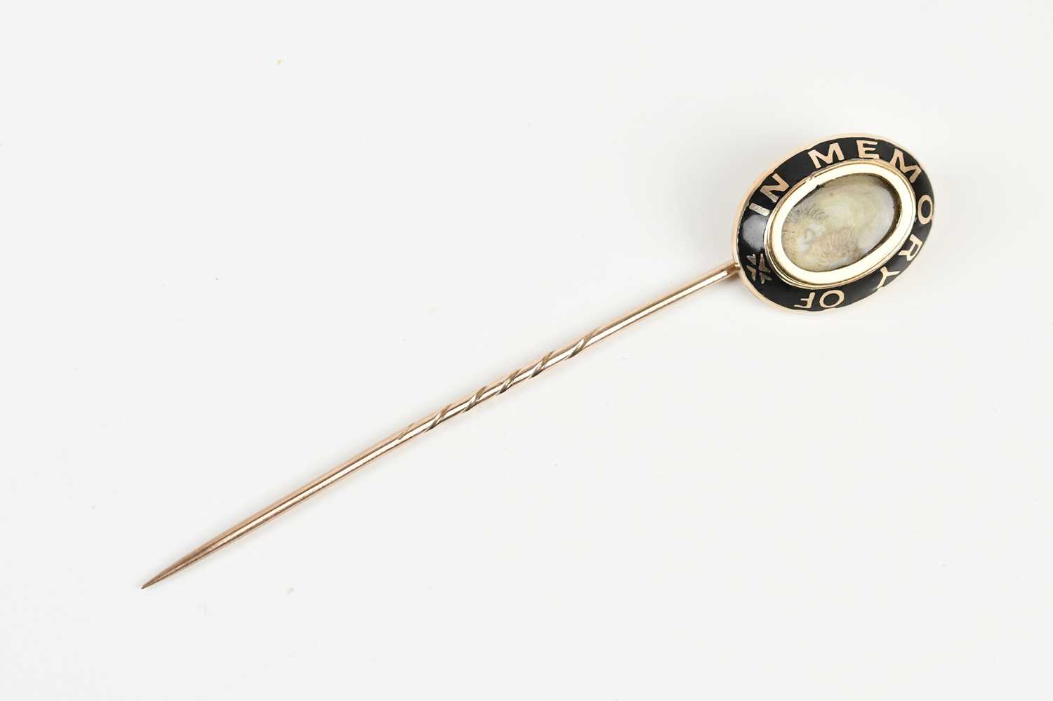Lot 1599 - A Victorian yellow metal mourning stick pin...