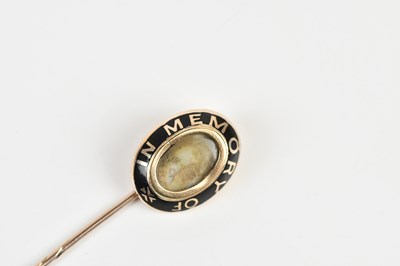 Lot 1599 - A Victorian yellow metal mourning stick pin...