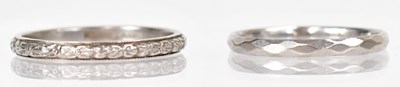 Lot 1258 - Two platinum wedding bands, one engraved with...