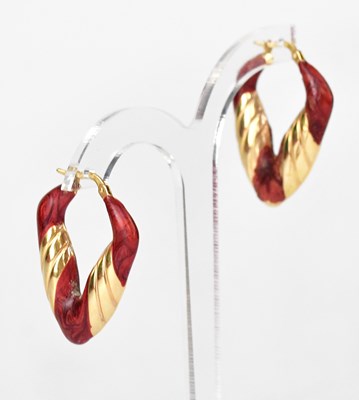 Lot 1375 - A pair of 9ct gold hoop earrings of triangular...