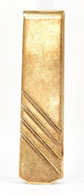 Lot 1476 - A 9ct yellow gold money clip with linear...