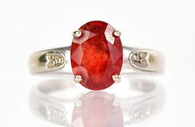 Lot 1279 - An 18ct white gold ring set with an oval facet...