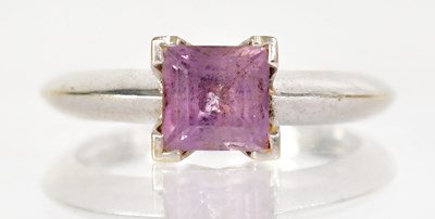 Lot 1270 - An 18ct white gold ring set with a square cut...