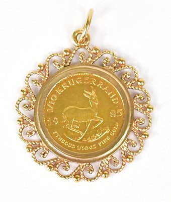 Lot 1439 - A 1/10 krugerrand, 1985, in a 9ct yellow gold...