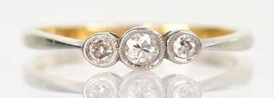 Lot 1283 - An 18ct yellow gold and platinum ring set with...