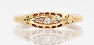 Lot 1291 - An 18ct yellow gold ring set with three white...