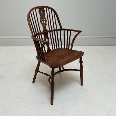 Lot 1233 - A 19th century yew wood Windsor elbow chair,...
