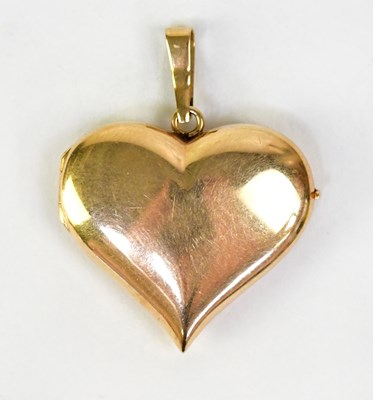 Lot 1433 - A 14ct yellow gold heart-shaped locket, approx....