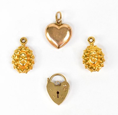 Lot 1434 - A 14ct yellow gold heart-shaped pendant charm,...