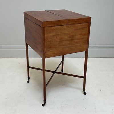 Lot 1221 - A Georgian mahogany square washstand with fold-...