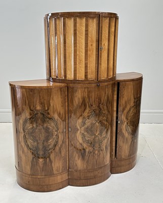 Lot 1011 - An Art Deco walnut cocktail cabinet in the...