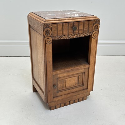 Lot 1037 - An Art Deco oak bedside cabinet with marble...