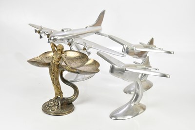 Lot 1612 - Three silvered metal Art Deco style models of...