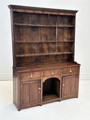 Lot 1059 - An early 19th century Welsh oak dresser, with...