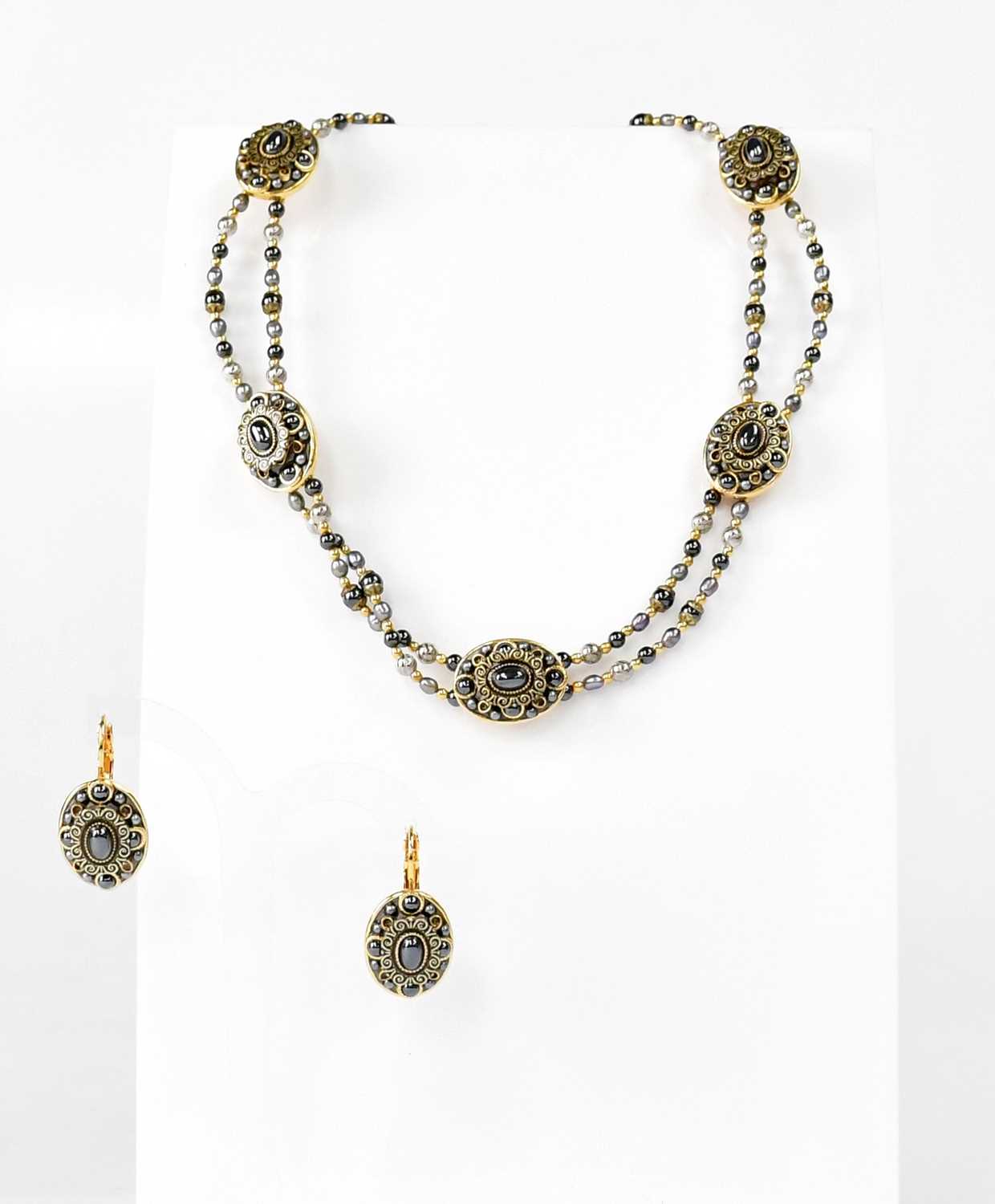 Lot 1124 - MICHAL GOLAN; a gold-coloured double-strand...