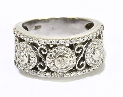 Lot 1237 - A 14ct white gold and diamond set broad...
