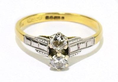 Lot 1238 - An 18ct yellow gold and twin stone diamond...