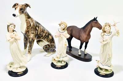 Lot 545 - WINSTANLEY; a model of a seated dog, height...