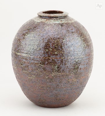 Lot 720 - A globular stoneware jar partially covered in...