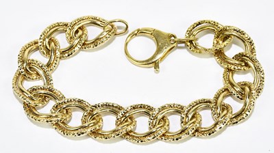 Lot 1287 - A yellow metal open hoop link bracelet stamped...