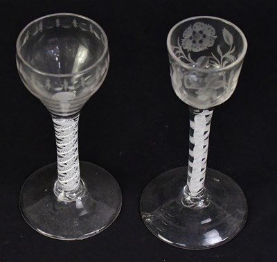Lot 565 - Two Georgian air twist stem wine glasses, one...