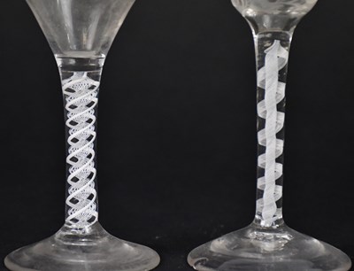 Lot 565 - Two Georgian air twist stem wine glasses, one...