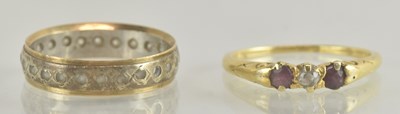 Lot 1234 - An 18ct yellow gold ruby and diamond set three...