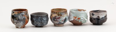 Lot 728 - A group of stoneware teabowls including a near...