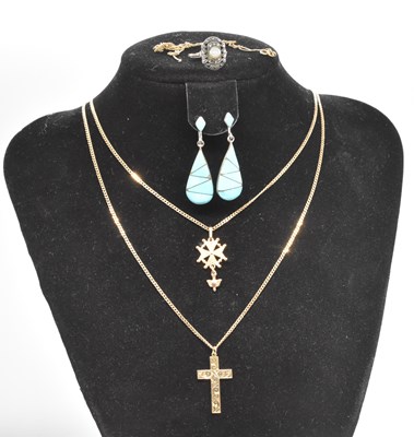 Lot 483 - Two 9ct yellow gold chains, one supporting a...