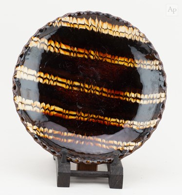 Lot 736 - A slipware plate with pie crust rim and...